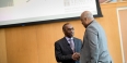 Larry Miller shaking hands with Temple's Jeffery Montague