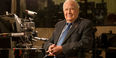 Lew Klein sitting in a TV studio