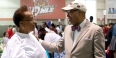 Michael Robinson talks with a woman at the Neighborhood Job Fair