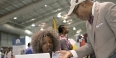 Two people talking at the job fair. 
