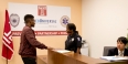A man talking with a police officer inside the new station
