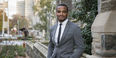 Hazim Hardeman standing on campus in front of the Bell Tower