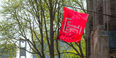 The Temple flag flies outside Sullivan Hall.