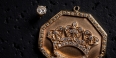 Tupac diamond earring and gold crown medallion