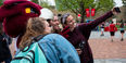 Students taking a selfie with Temple mascot Hooter