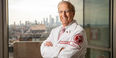 Dean Daly smiling in his white coat