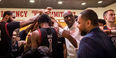 Aaron McKie and coaches, players huddle