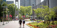 Students walk towards the Bell Tower on Main Campus.