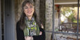 Author and Temple Professor Laura Levitt stands on the front porch of her home.