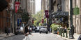 A young woman crosses the street in Center City.