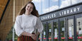 Kirtney Metz standing in front of Charles Library