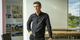 Gabriel Kaprielian wearing a black button down shirt and black pants