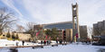  Students walking outside in the snow near the Bell Tower.
