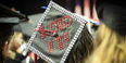 A student’s graduation cap with “I did it!” written in rhinestones. 