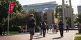Students walking by the bell tower 