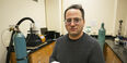 Image of Mehdi Khanzadeh holding a sample of carbonatable concrete.