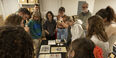 Students looking at archival materials in the William Way LGBT Community Center