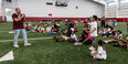 Image of Timothy Welbeck addressing the crowd at the Family Field Day event.