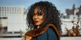 Image of Camille Bell in an outdoor space, looking into camera