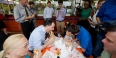 A political candidate eating a cheesesteak in Philadelphia.