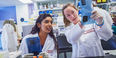 two students examining a document in Temple’s Cardiovascular Research Center.