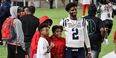 Shedeur Sanders pictured with two young men.