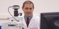 Domenico Praticò, professor of pharmacology, wearing a lab coat.