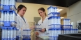 Engineering researchers handling test tubes in a lab.