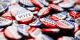 A pile of red, white and blue buttons. 