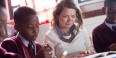 Teacher reads to a student.