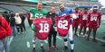  Image of Peyton Manning and Jason Kelce with Temple football at Lincoln Financial Field.  