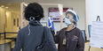 a medical assistant screening a patient
