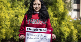 Evelyn Lara holding a Temple Made sign