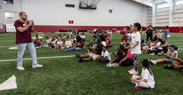 Image of Timothy Welbeck addressing the crowd at the Family Field Day event.
