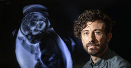 Vlad Ayzenberg next to a baby scan
