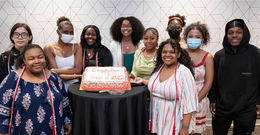 Temple Education Scholars with a cake 