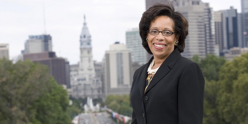 Temple Law School Dean JoAnn Epps with City Hall in the background. 