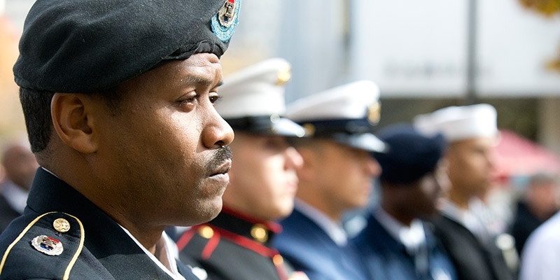 Uniformed service members attending a Temple Veterans Day ceremony.