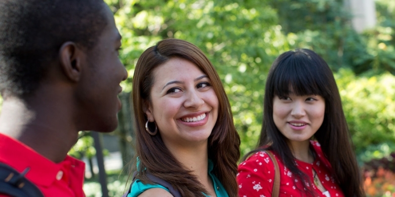 Three international students talking to each other on Temple’s Main Campus.