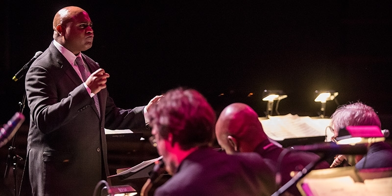 Terell Stafford conducting a jazz orchestra.