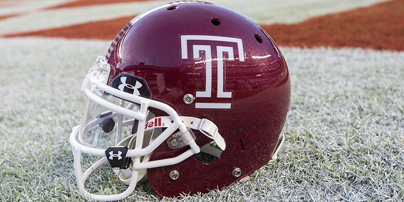 A football helmet in the end zone before a game.