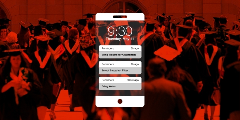 An iPhone with reminders in front of a graduation photo.