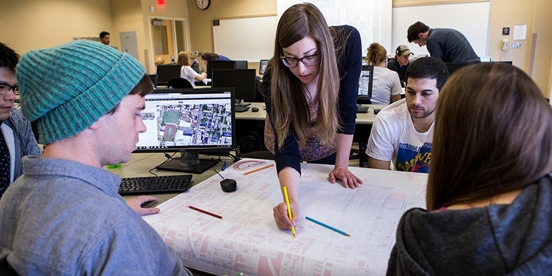 A group of students working on a design.