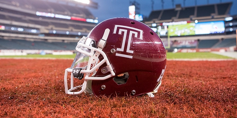 A cherry Temple football helmet with a white Temple “T.”