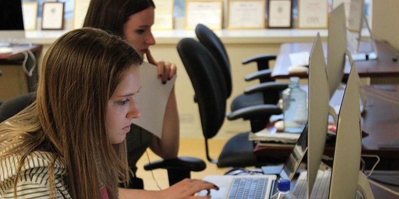 Student-journalists using computers in the Philadelphia Neighborhoods newsroom.