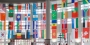 flags of countries around the world hanging in an atrium.