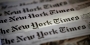 A spread of several New York Times newspapers.