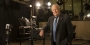 Lew Klein standing in a studio near a camera