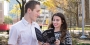 Adam Gasiewski standing with Emily Beck, who is holding a copy of Milk and Vine