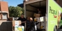 people unloading a Giant truck packed with donations